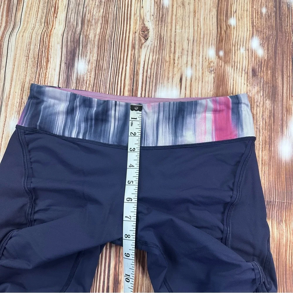 Lululemon Dark Navy ,colorful waist ban and slightly cropped leggings Size 8.